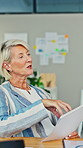 Mature, woman and discussion with documents in office for project budget, finance or planning. Female person, employee or conversation with paperwork for financial meeting or proposal in workplace