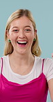 Face, woman and pointing up with smile in studio for news, announcement or show information. Happy, portrait and female person with promo for deal, sale or competition, giveaway on blue background