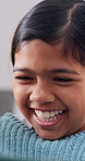 Laugh, tablet and child in home for online streaming, watching videos and relax on weekend. Happy, sofa and girl on digital tech for cartoon subscription, internet and funny movie for entertainment