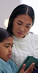 Happy, tablet and girl with mom on sofa for streaming, watching videos and online learning. Family, home and mother with child on digital tech for educational games, internet and bonding on weekend