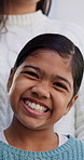 Smile, calm and face of child in home with growth on weekend break, holiday or vacation. Laugh, confident and portrait of girl kid with positive attitude, pride or development in living room at house