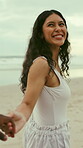 Guide, holding hands and laughing with woman on beach for holiday, travel or vacation. Funny, leading and love with happy couple outdoor in nature together for affection, bonding or weekend getaway