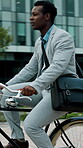 Business, commute and cycling in the city with black man on eco friendly transportation. Sustainability, travel and zero emission with employee on bike in urban town for trip to corporate workplace