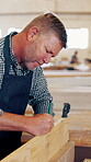 Carpenter, man and writing measurement in workshop with wood, ruler and precision for process. Mature person, woodworking and manufacturing in factory for handmade, custom and production of design