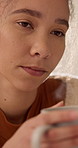 Thinking, woman and planning with coffee, serious and student with academic goal or future decision. Remember, past and person with beverage, reflection and contemplating college choice and options
