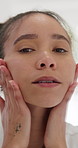 Skincare, face and woman in bathroom to check skin for blemish, acne and wellness for glow. Natural cosmetics, person and pimple inspection in home for beauty, dermatology and touch for self care