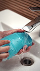 Hygiene, bathroom and hands of person with sex toy for washing, germ prevention and maintenance. Sink, home and woman with faucet, water and sensual accessory for wellness, cleaning and disinfection