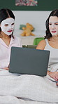 Friends, skincare and relax in home with laptop, spa day and discussion for movie choice on weekend. Women, talk and bonding in house with computer, facial mask and browsing for online entertainment.