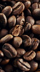 Closeup, roasted and coffee beans with blend for harvest, production and textures for caffeine. Rustic, granules and arabica grain for manufacturing, fermentation process and rich flavor for brewing