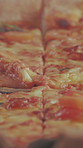 Closeup, baked and pizza in box for takeaway, melted cheese and Italian recipe for fast food. Fresh, unhealthy and cardboard with flatbread, traditional cuisine and gourmet takeout for hospitality