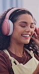 Headphones, dance and woman in home with audio, smile and streaming service on weekend break. Music, happy person and listening to favorite song, sound or hip hop playlist on radio at apartment