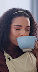 Coffee, phone and woman in home with relax, calm or peaceful weekend break with texting on mobile app. Happy, drinking and person with warm beverage and cellphone for chatting, social media or blog.