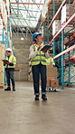 Smile, woman and logistics at warehouse with tablet, inspection and supply chain for stock delivery. Happy, person and walk at depot with digital, shipping compliance and information for distribution