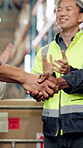 People, logistics and applause with handshake in warehouse for shipping or distribution partnership. Employees, colleagues or shaking hands with team in depot for supply chain deal, b2b or success