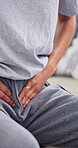 Woman, hands and stomach pain in home, discomfort or health condition with PMS or menstruation. Female person, agony on sofa or ill with viral infection, gastro abdominal cramps or endometriosis 