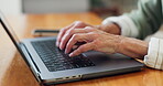 Hands, laptop and report with business person at desk in office for online planning or research. Computer, keyboard and typing with mature woman in workplace for agenda, digital calendar or schedule