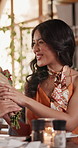 Surprise, couple and flowers at restaurant with love, bonding or gift for valentines day celebration. Happy man, woman and roses on date with shock, romantic present or smell bouquet with gratitude