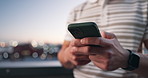 Phone, hands and person outdoor at night for online communication, text and update with bokeh. Mobile, typing and man in city for internet post, notification and social media message with space