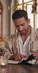 Menu, man and customer with order in restaurant for food option, service or choice on weekend break. Happy, talking and person in cafe for diner selection, decision or breakfast request on holiday.