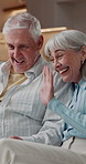 Relax, video call and wave with old couple on sofa in home living room for bonding or streaming. App, conversation and greeting with happy senior people in apartment for communication or retirement