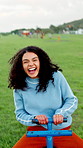 Face, fun and laughing with woman on seesaw in park for holiday, vacation or weekend. Happy, portrait and pov with female person at outdoor playground in nature for energy, excitement or wellness