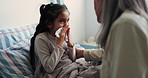 Woman, bedroom and sick child with tissue for sneeze, flu or sinus symptom and help in family home. Girl kid, ill grandchild and grandmother with support for allergies, recovery or healing