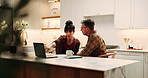 Laptop, couple and discussion for budget in kitchen, review expenses and mortgage paperwork. Computer, mature man and woman with bills, insurance application or pointing for planning savings at home