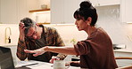 Laptop, couple and argument for bills in kitchen, wrong expenses or stress with mortgage paperwork. Computer, mature people and debt quarrel, financial conflict and point for disagreement at home