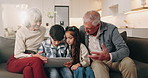 Grandparents, children and sofa with tablet for interaction, online game or engagement in home. Grandpa, grandma and siblings playing with technology together for network, connection or app in house