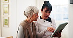 Consulting, old woman or caregiver with tablet in home for care plan, symptom tracking or service. Explain, senior patient or carer with tech in homecare for health records, medical update or support