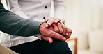 Holding hands, home and senior person with caregiver, comfort and wellness in health community. People, closeup and elderly patient with support, retirement or help with compassion or medical service
