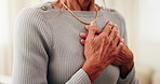 Senior, woman or hands with chest pain in home for cardiac arrest, heart attack or breathing cramp. Elderly, female person or sore ache with disease for chronic stress, pneumonia or illness in house