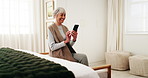 Senior, woman and laugh in retirement home with phone, funny news and notification for text message. Happy, elderly person and typing in bedroom with tech, social media post or humor for online meme.