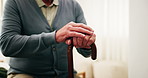 Hands, old man and relax at house with walking stick, mobility support and recovery from injury. Cane, balance and senior person with disability, muscle stiffness and stability from parkinson disease