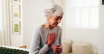 Senior, woman or bed with chest pain in home for bronchitis, heart attack or cardiac arrest. Elderly, female person or sore ache with viral disease or chronic stress for pneumonia or illness in house