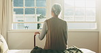 Thinking, back or old woman in home with walking stick, daydream or nostalgia in calm mindset. Reflection, flare and elderly person with disability, flashback or peaceful perspective in retirement.
