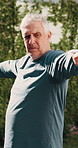 Senior, man and yoga with trainer outdoor, exercise and wellness with stretching for posture. Male person, coach and help with advice for warrior pose, fitness and balance with support in nature