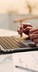 Woman, hands and typing with laptop in home for finance, online investment or application. Female person, computer and paper with digital registration for financial planning or research in house