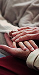 Holding hands, sick child and grandparent comfort in bed for emotional support, empathy or flu recovery. Health, kid and senior family with compassion for illness, care and healing from virus in home