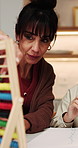 Mom, kid and learning in home with abacus, homework discussion and math problem solving for growth. Woman, talk and daughter in house with counting tool, education task or help for child development.