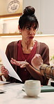 Couple, finance and documents with discussion in kitchen for mortgage payments, bills or investment. Mature man, woman and conversation with paperwork for financial planning or invoices in home