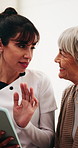 Senior woman, smile and caregiver with tablet in house, consultation or explaining medical diagnosis. Retirement, home and nurse with tech, talk and healthcare information on web for elderly person