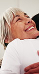 Support, caregiver and old woman in house with hug, understanding or comfort in elderly care. Compassion, senior person or volunteer in home with embrace, trust and loving connection in retirement.