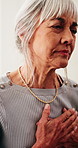 Sick, tired and old woman in home with chest pain, stress or heart attack symptoms for medical issue. Elderly person, health crisis and emergency in house with cardiac arrest, discomfort and fatigue.