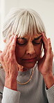 Headache, stress or senior woman with pain in home for mental health, vertigo or dizziness. Frustrated, female person or migraine with dementia or anxiety for pressure, strain or tension in house