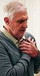 Stress, old man and breathe in home with chest pain, heart attack and panic of medical condition. Discomfort, senior person and angina at house with cardiac arrest, lung infection and chronic illness
