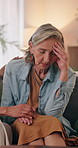 Sad, woman and conversation in home with friends, emotional support and empathy for healing from grief. Upset, mature people and comfort on couch with trust, holding hands and talk to process trauma.