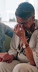 Woman, crying and holding hands in home with friends, emotional support and help for healing from loss. Sad, mature people and tears in living room with trust, understanding and empathy for grief.