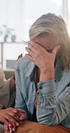 Woman, crying and holding hands in house with friends, support and empathy for healing from loss. Upset, mature people and tears on sofa with trust, understanding and help to process trauma together.