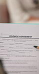 Person, hands and document with divorce agreement for legal contract, funding or consent form. Paper, settlement or binding application for marriage termination, responsibility or maintenance support